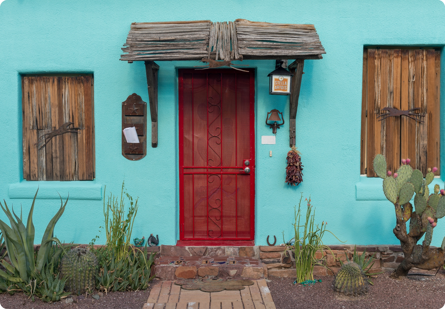Light blue house with red front door